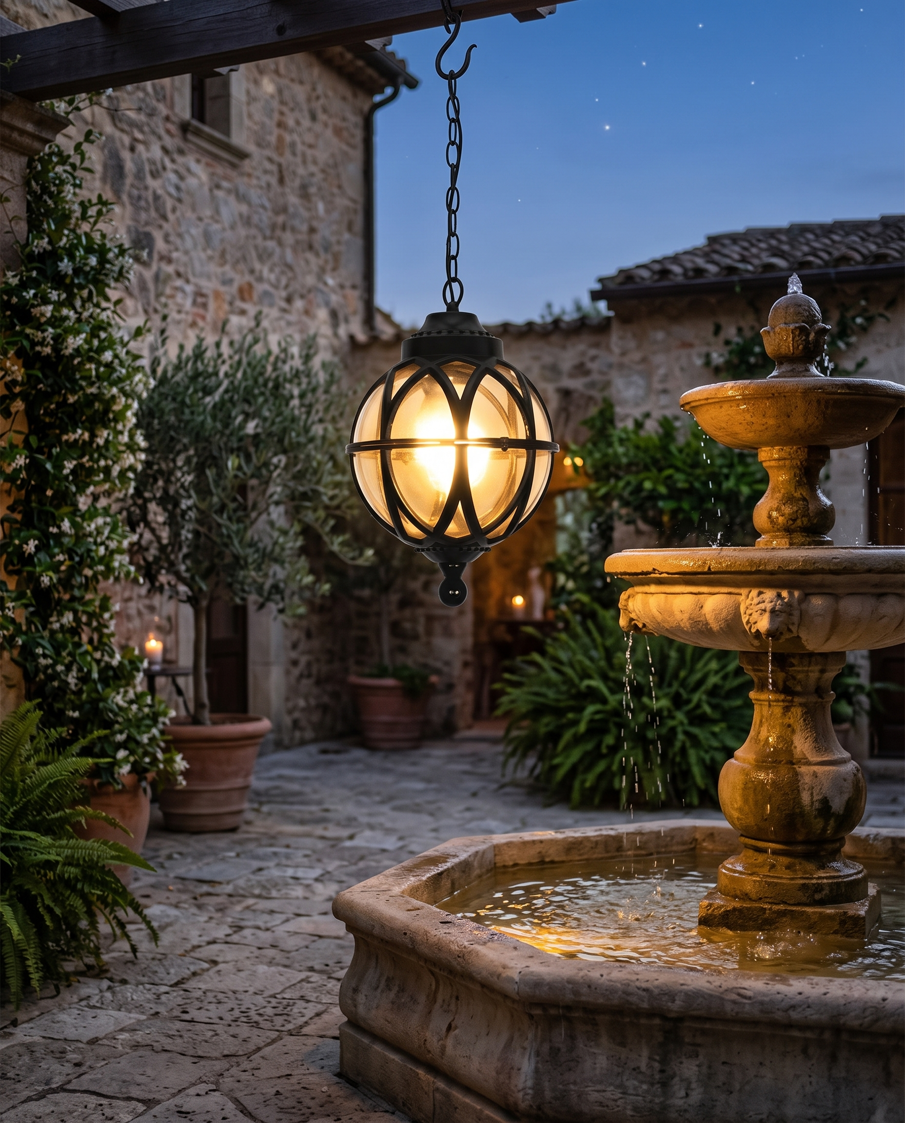 Black orb pendant light in a stone courtyard