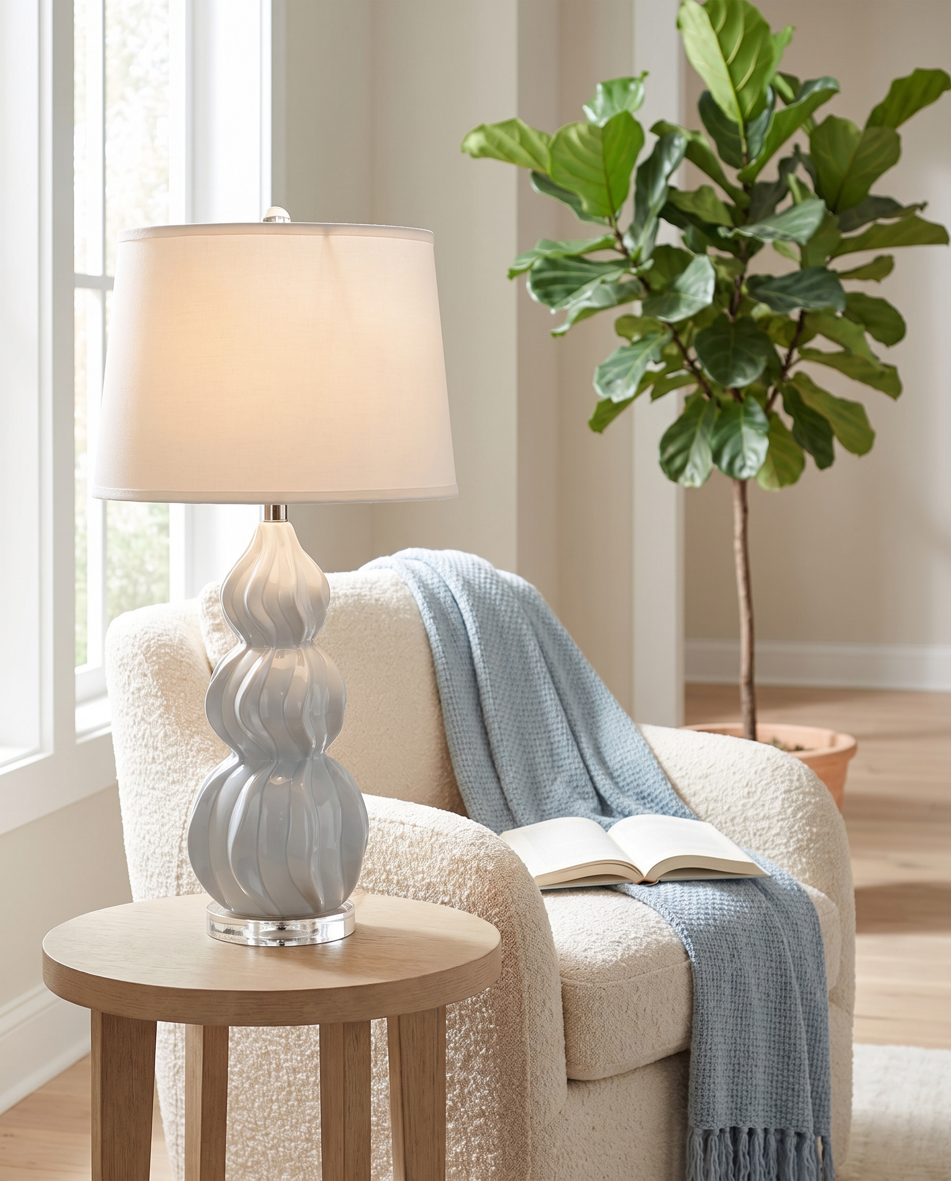 Juno gray-blue ceramic gourd table lamp in a reading nook