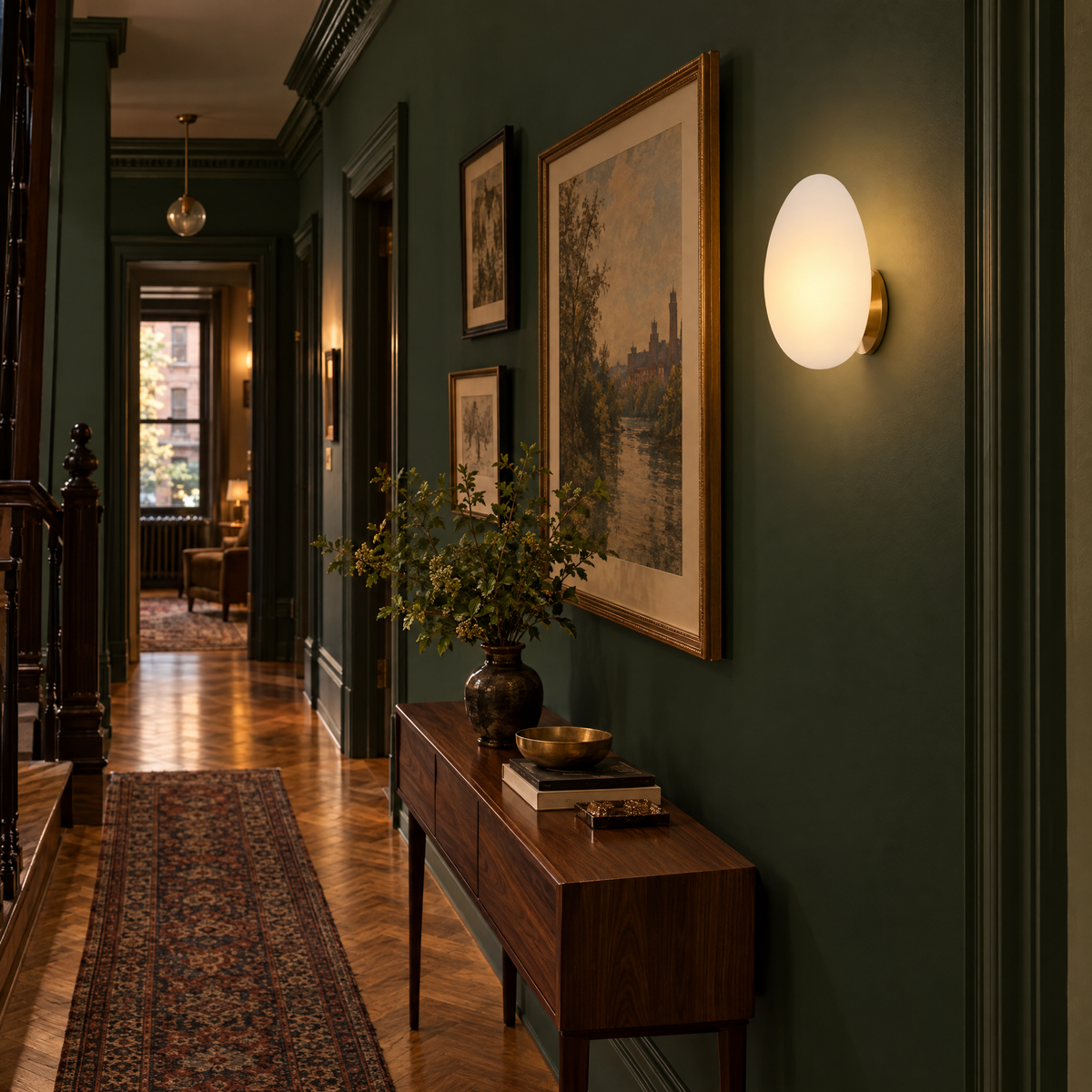 Opaline wall sconce in White & Gold, shape ∅8.6" x H13.7" in a Brooklyn brownstone hallway