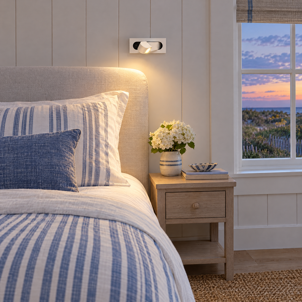 Lectra bedside reading wall light in matte white in a Hamptons shingle-style beach house guest bedroom