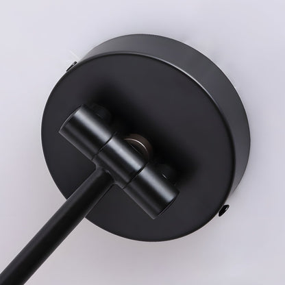 Close-up of the Soren Nordic Swing Arm Wall Sconce matte black wall plate and adjustable knuckle joint