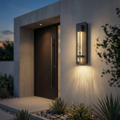 Perle bubble-glass sconce beside modern entrance at dusk