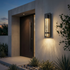 Perle bubble-glass sconce beside modern entrance at dusk