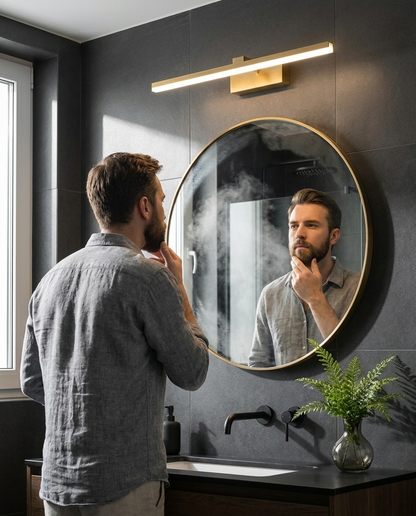 Man grooming using the Lumera Mirror Light in a modern dark bathroom