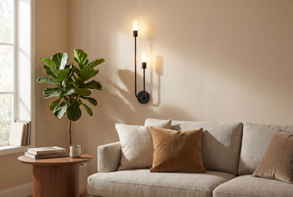 Black Gemini Dual Head LED Wall Sconce above a living room sofa