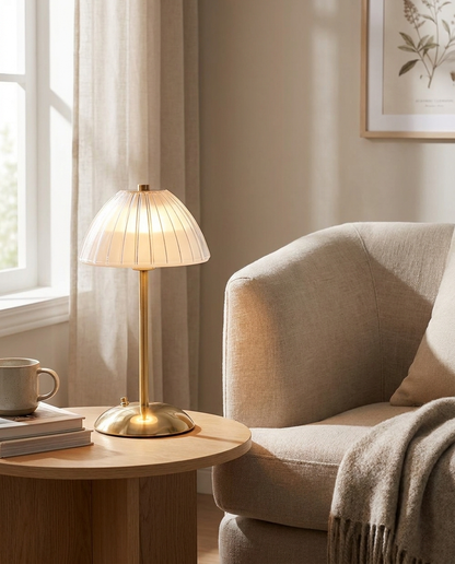Elara brushed brass cordless table lamp in a reading nook