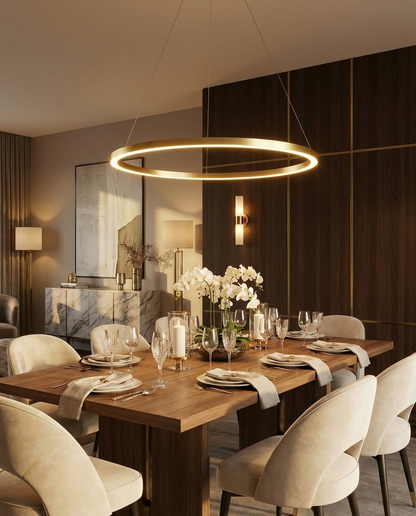 Halo gold LED ring chandelier above a dining table