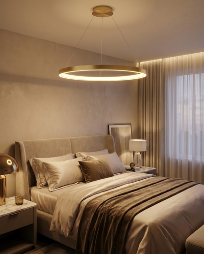 Halo gold LED ring chandelier above a bed