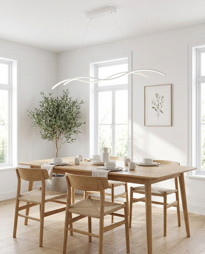 Marisse white wave pendant over a Scandinavian dining table