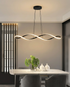 Novene black waveform pendant over a dining table