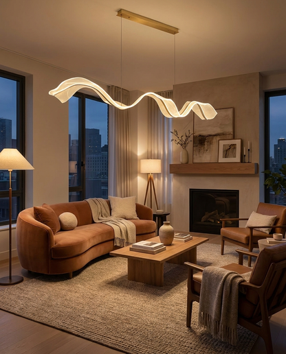 Cirelle gold ribbon wave pendant over a living room lounge