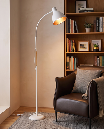 White Alder wood arc floor lamp in a reading nook