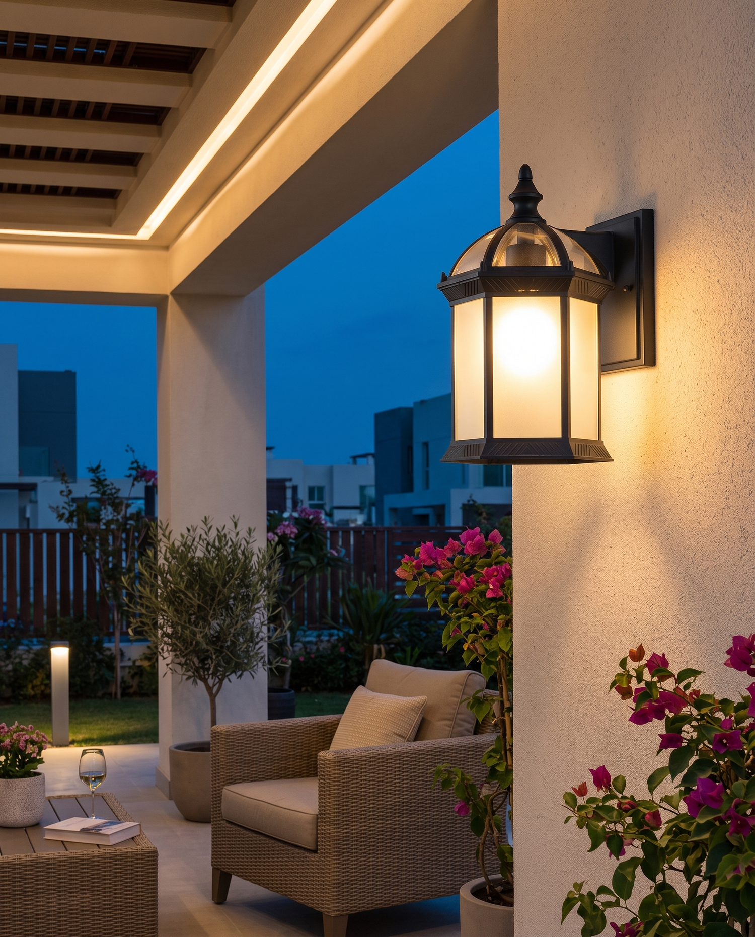 Wall-mount black patio sconce on a stucco patio wall