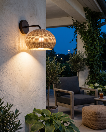 Rattan wall sconce on a covered porch wall