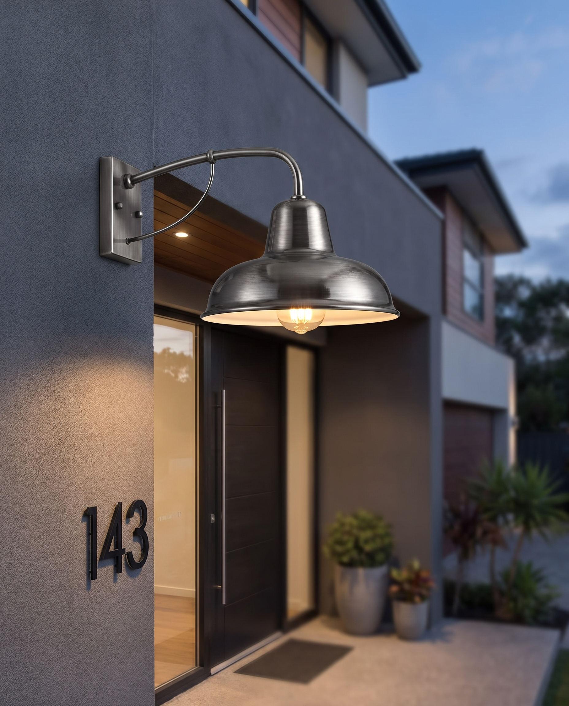 Ferro Barn Wall Sconce in Silver Black on a modern house entryway