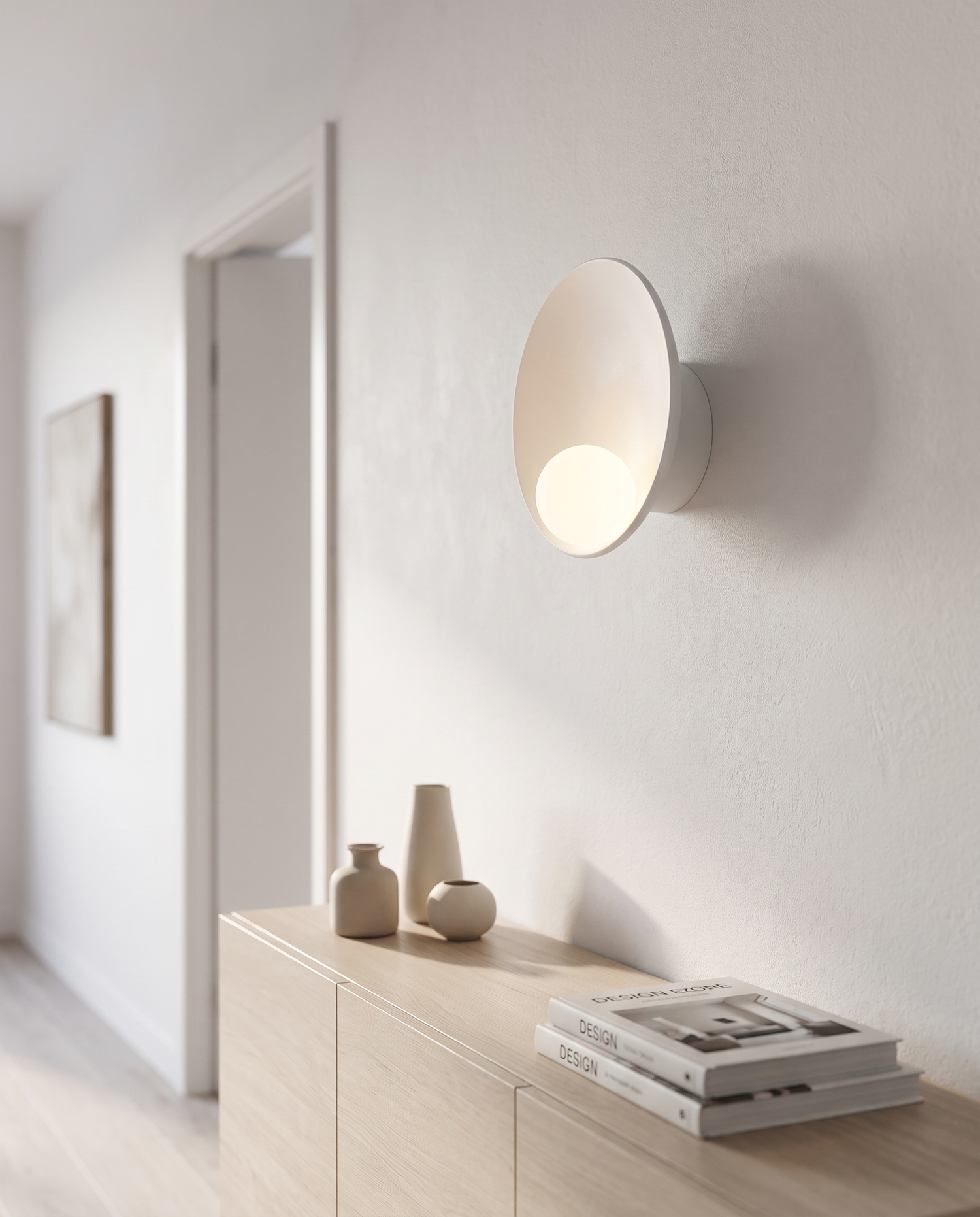 Luna Round Wall Sconce in White in a hallway