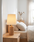 Seol Table Lamp in Wood on a bedroom nightstand