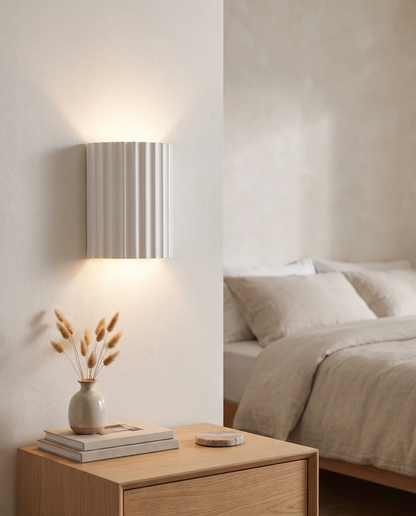 Momo Wall Sconce in White in a bedroom