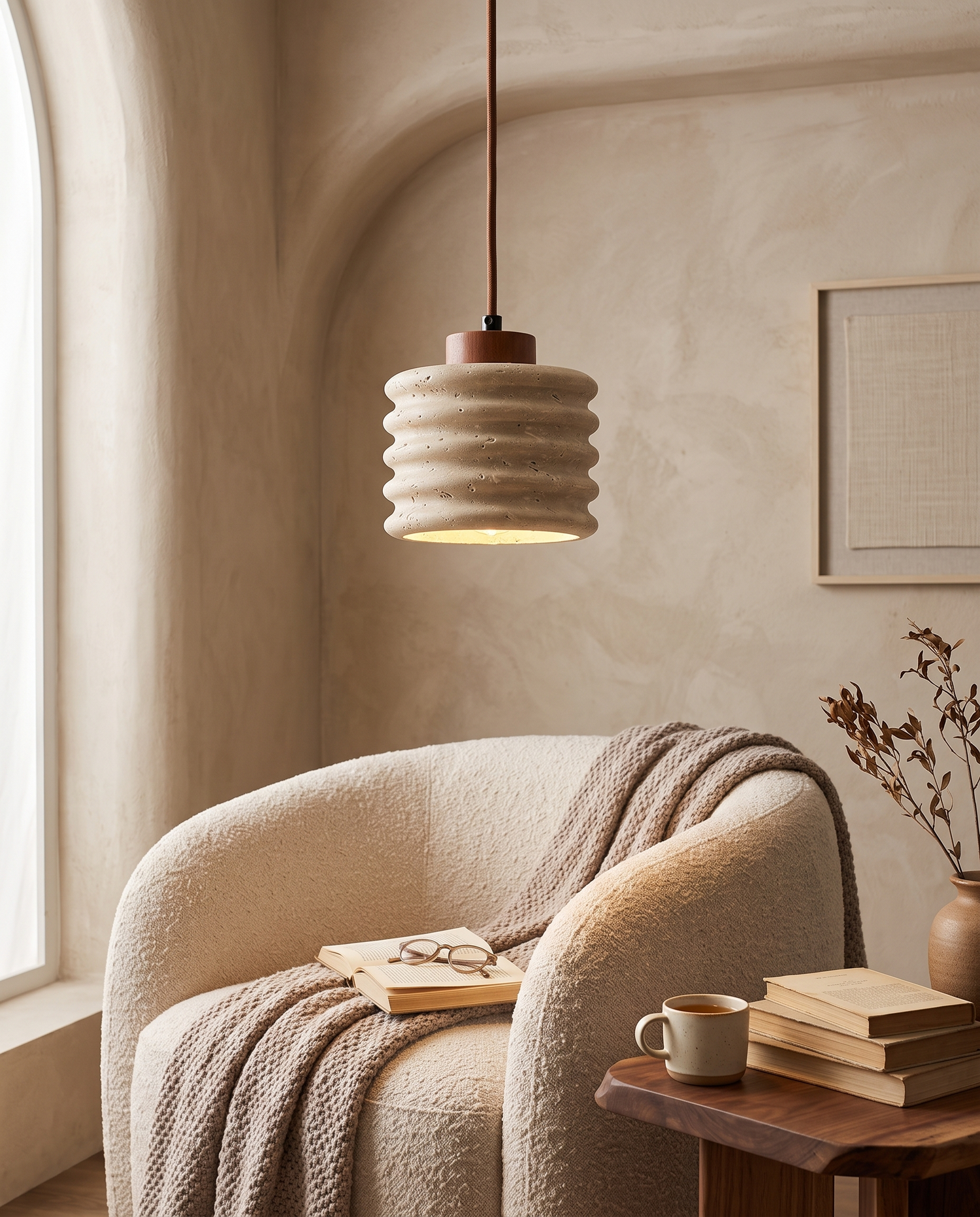Onda Travertine Pendant Light in a reading nook