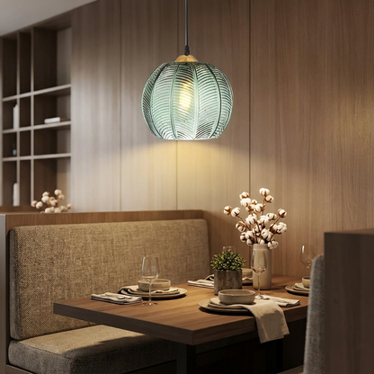 Foglia Green Glass Pendant over a dining booth
