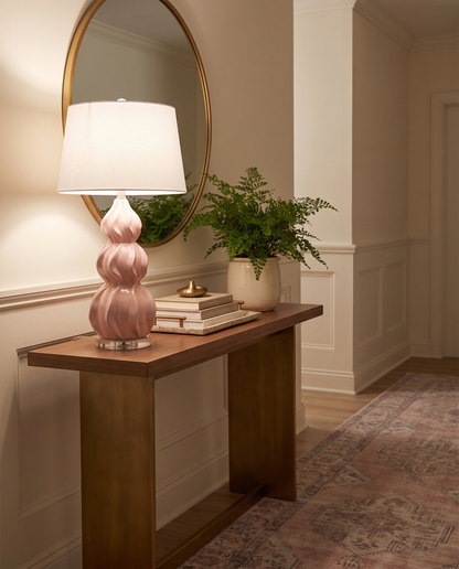 Juno pink ceramic gourd table lamp on a hallway console