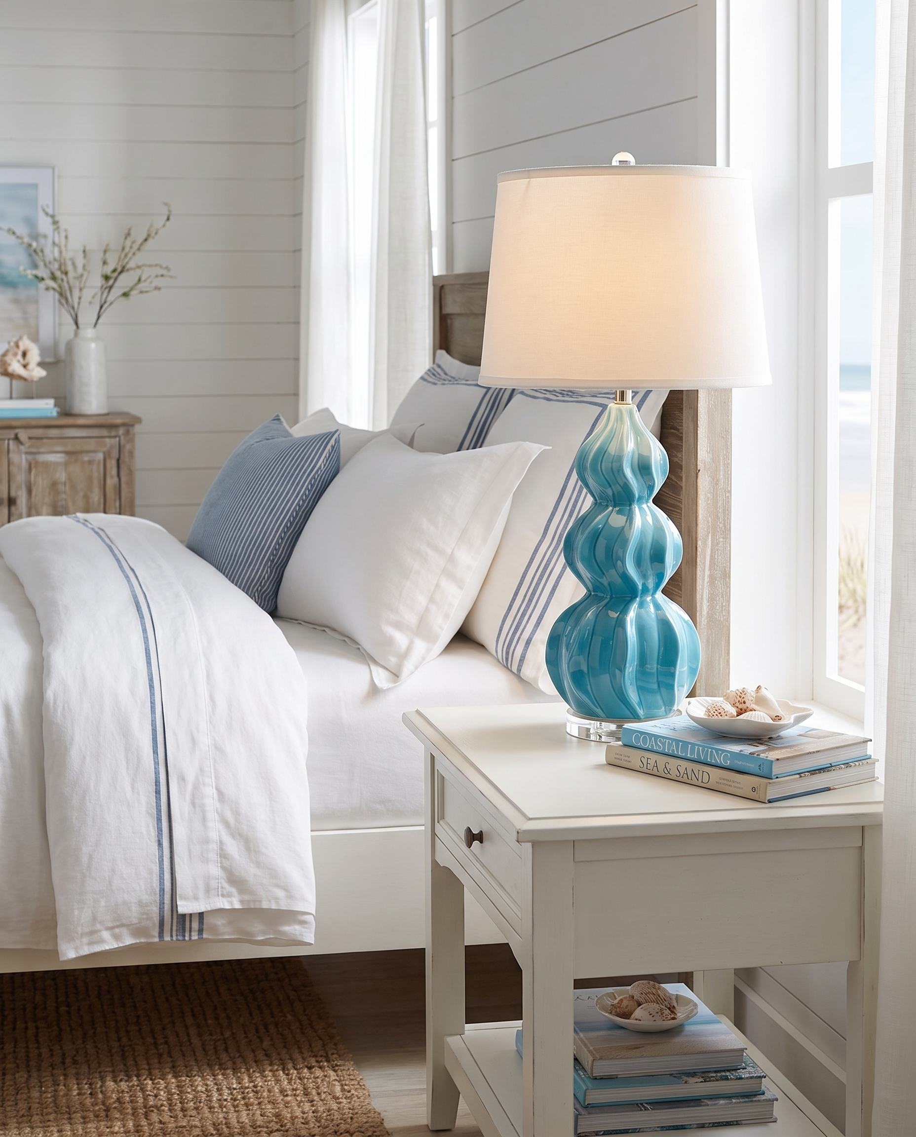 Juno lake blue ceramic gourd table lamp in a coastal bedroom