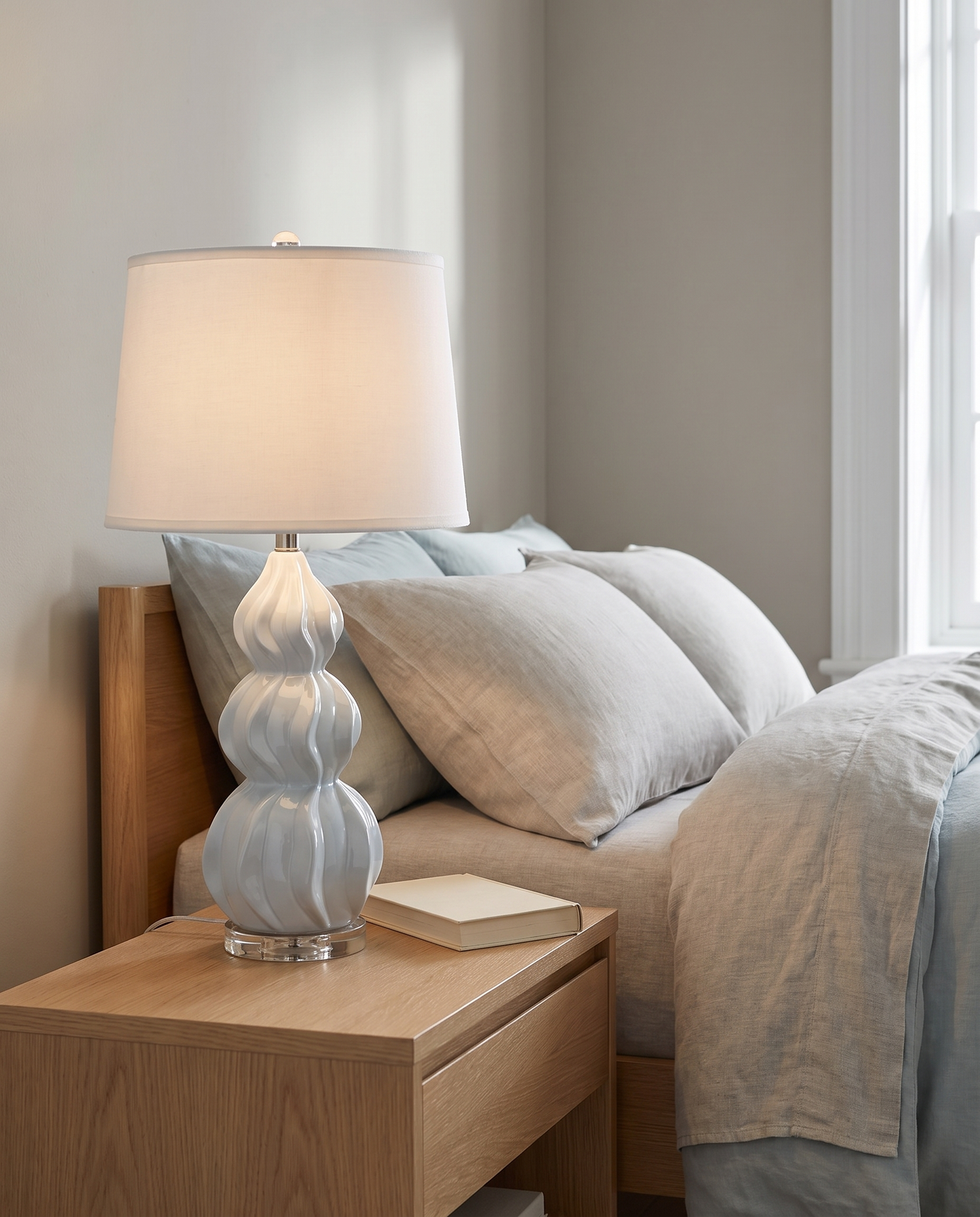 Juno gray-blue ceramic gourd table lamp in a minimalist bedroom