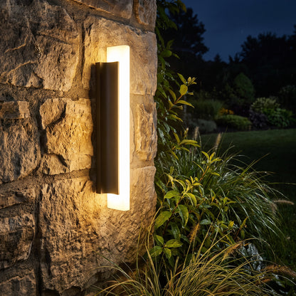 Petra outdoor wall light on a garden wall