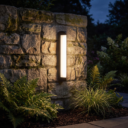 Cato column outdoor sconce on a garden wall