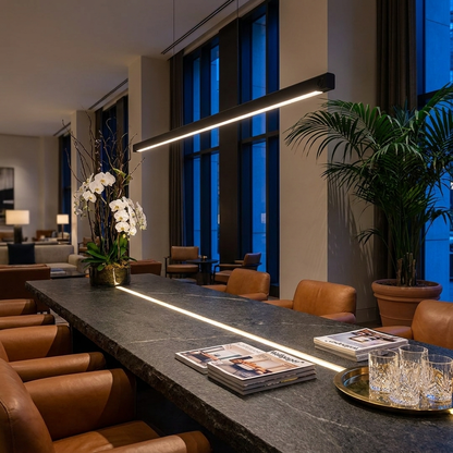 Winslow black linear suspension light over a hotel lobby lounge table