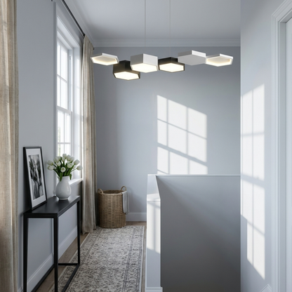 Tamsin white and black geometric LED chandelier on an upstairs landing