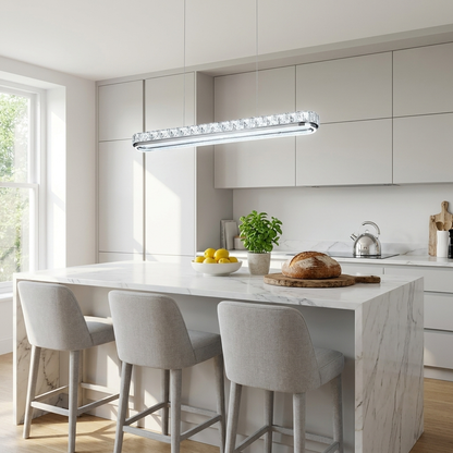 Sterling chrome crystal linear pendant light over a marble kitchen island