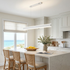 Sinclair white up and down island light over a coastal kitchen island