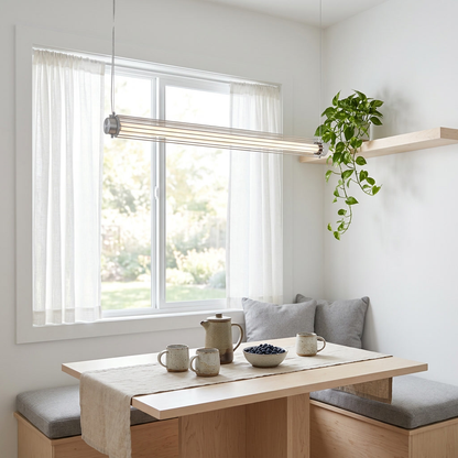 Stanton silver linear tube pendant light over a Scandinavian breakfast nook
