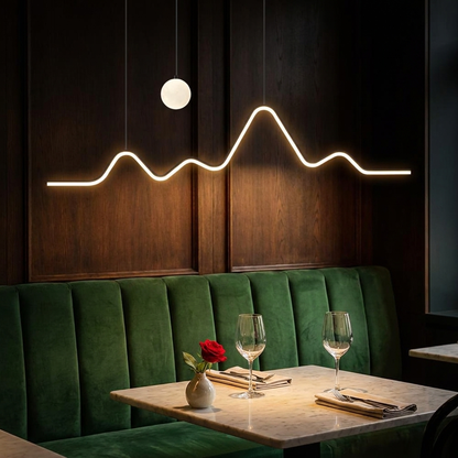 Sullivan black mountain moon LED chandelier over a restaurant banquette table