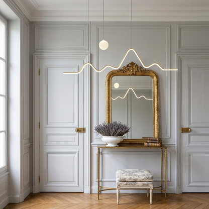 Sullivan gold mountain moon LED chandelier on a French classic landing
