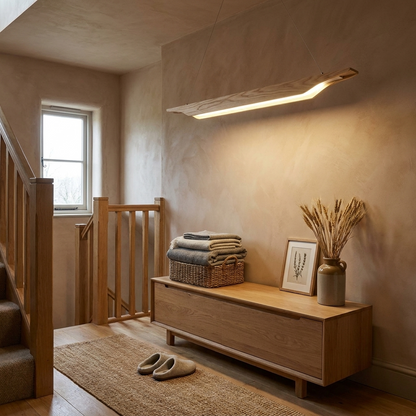Sheridan natural wood linear LED pendant over a console on a timber landing