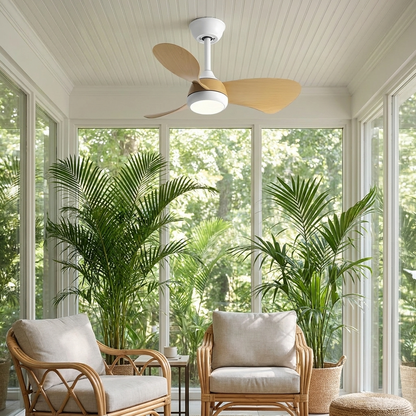 Manon white wood grain ceiling fan with light in a garden sunroom with rattan chairs and palms