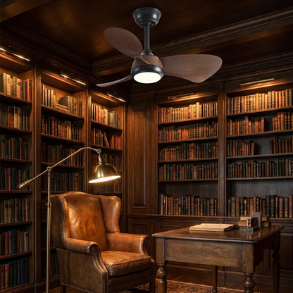 Manon black walnut ceiling fan with light in a moody study with library bookshelves