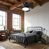 Rivelle black three blade ceiling fan light in an industrial loft bedroom