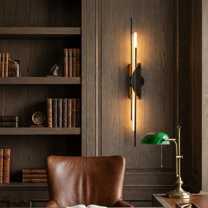 Verlaine black brass linear wall sconce in a refined study with dark oak shelving