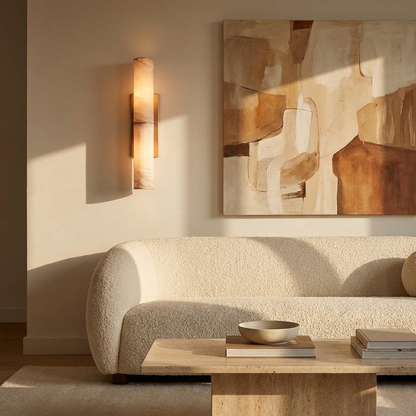 Natural copper marble sconce beside abstract artwork in a sunlit living room