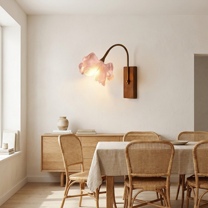 Walnut and pink blossom wall light above an oak credenza in a dining room
