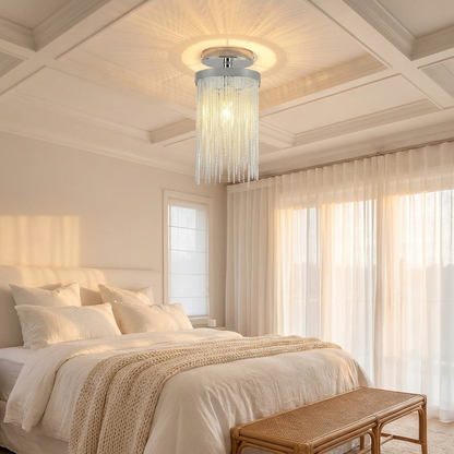 Odetta chrome metal tassel chandelier in a serene bedroom