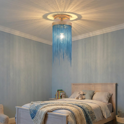 Odetta blue metal tassel chandelier in a soft blue grey bedroom