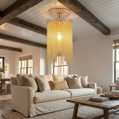 Odetta gold metal tassel chandelier in a modern farmhouse living room with beams
