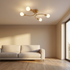 Calla curved arm flush mount ceiling light in a minimalist living room