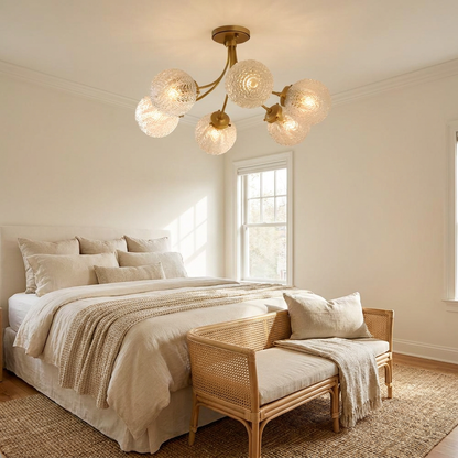 Verriere carved glass brass ceiling light in a soft neutral guest bedroom