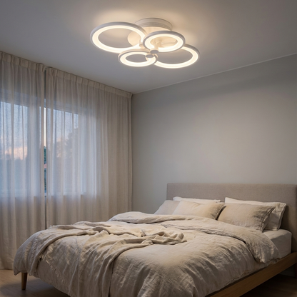 Anneau white multi ring LED ceiling light in a calm bedroom