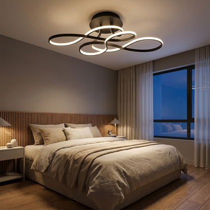 Lisse black curved ribbon ceiling light in a contemporary bedroom